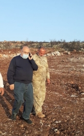 With a technician in the field.